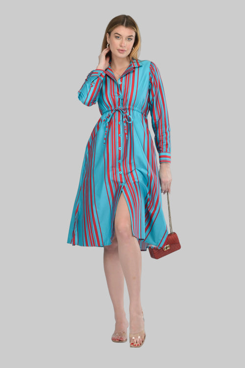 Woman wearing a blue and red striped dress on a gray background